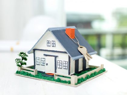 real estate with house model keys